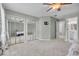 Bright bedroom featuring mirrored closet doors and access to bathroom at 679 Scarlet Oak Cir # 113, Altamonte Springs, FL 32701