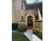 Arched entryway to townhome with landscaping at 7651 Sugar Bend Dr # 7651, Orlando, FL 32819