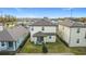 Aerial view of two-story house with backyard and neighborhood view at 7959 Delwin Ln, Kissimmee, FL 34747