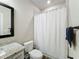 Small bathroom with shower/tub combo and granite vanity at 7959 Delwin Ln, Kissimmee, FL 34747