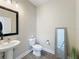 Small bathroom with single sink vanity and toilet at 7959 Delwin Ln, Kissimmee, FL 34747
