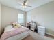 Bedroom with a double bed and ceiling fan at 7959 Delwin Ln, Kissimmee, FL 34747