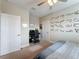 Spacious bedroom with car racing decor, built-in desk, and large bed at 7959 Delwin Ln, Kissimmee, FL 34747