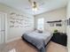 Bedroom featuring a double bed and race track wall decor at 7959 Delwin Ln, Kissimmee, FL 34747