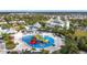Aerial view showing community pool, waterpark, and clubhouse at 7959 Delwin Ln, Kissimmee, FL 34747