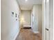 Upstairs hallway with bench and access to bedrooms at 7959 Delwin Ln, Kissimmee, FL 34747