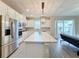 Modern kitchen with white cabinets and island at 7959 Delwin Ln, Kissimmee, FL 34747