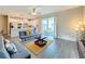 Open concept living space with kitchen and sliding glass doors at 7959 Delwin Ln, Kissimmee, FL 34747