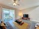 Living area with sliding glass doors leading to patio at 7959 Delwin Ln, Kissimmee, FL 34747