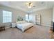 Spacious main bedroom with king-size bed and large windows at 7959 Delwin Ln, Kissimmee, FL 34747