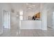 Open dining area with tile floor and kitchen access at 913 Cassia Dr, Davenport, FL 33897