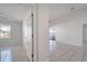 Clean hallway with tile floor and access to rooms at 913 Cassia Dr, Davenport, FL 33897