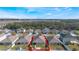 Property's aerial view showcasing the house and surrounding community at 1577 Diamond Loop, Kissimmee, FL 34744