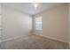 Simple bedroom with carpeted floor and a window at 1577 Diamond Loop, Kissimmee, FL 34744
