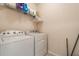 Laundry room with Whirlpool washer and dryer at 1577 Diamond Loop, Kissimmee, FL 34744