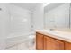 Bathroom featuring a tub/shower, toilet, and wooden vanity with light countertop at 1079 Berkeley Dr, Kissimmee, FL 34744