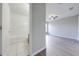 View of a bathroom with a shower/tub combo and a bedroom beyond at 1079 Berkeley Dr, Kissimmee, FL 34744