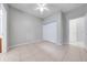 Bedroom featuring tiled floor, a ceiling fan, and closet space at 1079 Berkeley Dr, Kissimmee, FL 34744