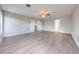 Empty bedroom with wood-look floors and multiple entryways at 1079 Berkeley Dr, Kissimmee, FL 34744