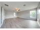 Spacious bedroom with wood-look flooring and ample natural light at 1079 Berkeley Dr, Kissimmee, FL 34744