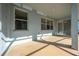 Covered back patio with windows offering view of the home's interior at 1079 Berkeley Dr, Kissimmee, FL 34744