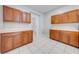 Wood kitchen cabinets offer plenty of storage at 1079 Berkeley Dr, Kissimmee, FL 34744