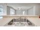 Close-up of the double stainless steel kitchen sink at 1079 Berkeley Dr, Kissimmee, FL 34744
