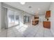 Kitchen and dining area with tile flooring and sliding glass doors at 1079 Berkeley Dr, Kissimmee, FL 34744