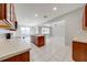 Spacious kitchen with ample counter space, wood cabinets, and stainless steel appliances at 1079 Berkeley Dr, Kissimmee, FL 34744