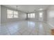 Open living area with tiled floors and large windows at 1079 Berkeley Dr, Kissimmee, FL 34744