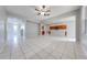 Spacious living room with tile flooring and access to the kitchen at 1079 Berkeley Dr, Kissimmee, FL 34744