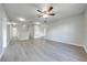 Bright, spacious living room with new wood-look flooring and neutral paint at 1079 Berkeley Dr, Kissimmee, FL 34744