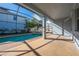 Covered patio overlooking the screened-in pool and spa at 1079 Berkeley Dr, Kissimmee, FL 34744