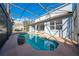 Private pool area with screened enclosure and surrounding patio at 1079 Berkeley Dr, Kissimmee, FL 34744