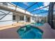 Screened-in pool and spa with ample space for lounging at 1079 Berkeley Dr, Kissimmee, FL 34744