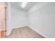 Empty walk-in closet with wire shelving and wood-look flooring at 1079 Berkeley Dr, Kissimmee, FL 34744