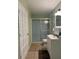 Clean bathroom with a shower/tub combo and updated vanity at 116 S 4Th St, Haines City, FL 33844