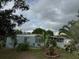 Ranch style home with mature landscaping and a spacious yard at 116 S 4Th St, Haines City, FL 33844