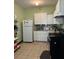 Efficient kitchen with white cabinets and appliances at 116 S 4Th St, Haines City, FL 33844