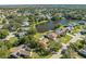 Aerial view showcasing home's setting near a lake within a residential community at 1416 Wood Lake Cir, St Cloud, FL 34772