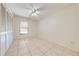 Spacious bedroom with tile floors and ceiling fan at 1416 Wood Lake Cir, St Cloud, FL 34772