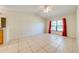 Bright bedroom with tile flooring and ceiling fan at 1416 Wood Lake Cir, St Cloud, FL 34772
