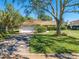 House exterior showcasing a spacious yard and driveway at 1416 Wood Lake Cir, St Cloud, FL 34772