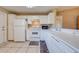 White kitchen features ample counter space and a microwave at 1416 Wood Lake Cir, St Cloud, FL 34772