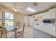 Bright eat-in kitchen with white cabinetry and modern appliances at 1416 Wood Lake Cir, St Cloud, FL 34772
