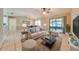 Comfortable living room with neutral decor and access to patio at 1416 Wood Lake Cir, St Cloud, FL 34772