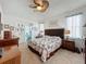 Large main bedroom with a comfortable bed and ceiling fan at 1646 Dunes Ct, Haines City, FL 33844