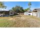 Spacious backyard with storage shed and wooden fence at 201 Edgewater Dr, Saint Cloud, FL 34769