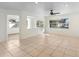 Open concept living area with tile floors and view of backyard at 201 Edgewater Dr, Saint Cloud, FL 34769