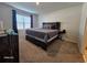 Spacious bedroom with a dark wood platform bed at 2672 Harmonia Hammock Rd, Harmony, FL 34773